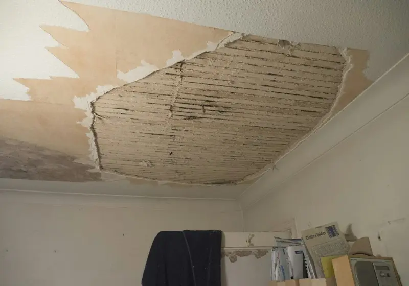 Plumber checking pipes after a flood